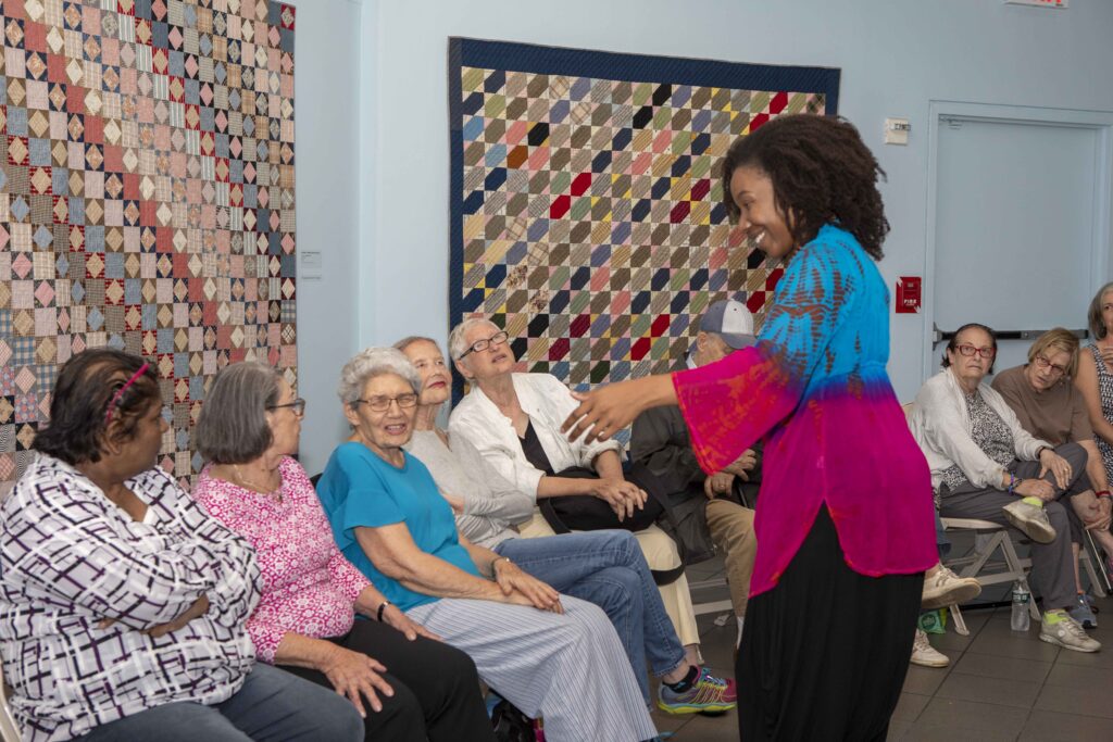 Picture of Onome leading "Vocal Tapestry" at American Folk Art Museum