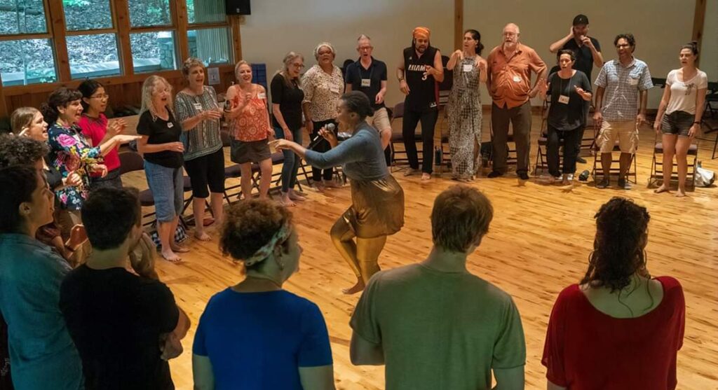 Gallery image of Onome leading "The Archetypes of Play" workshop at the Corclesongs Retreat at Omega Institute.